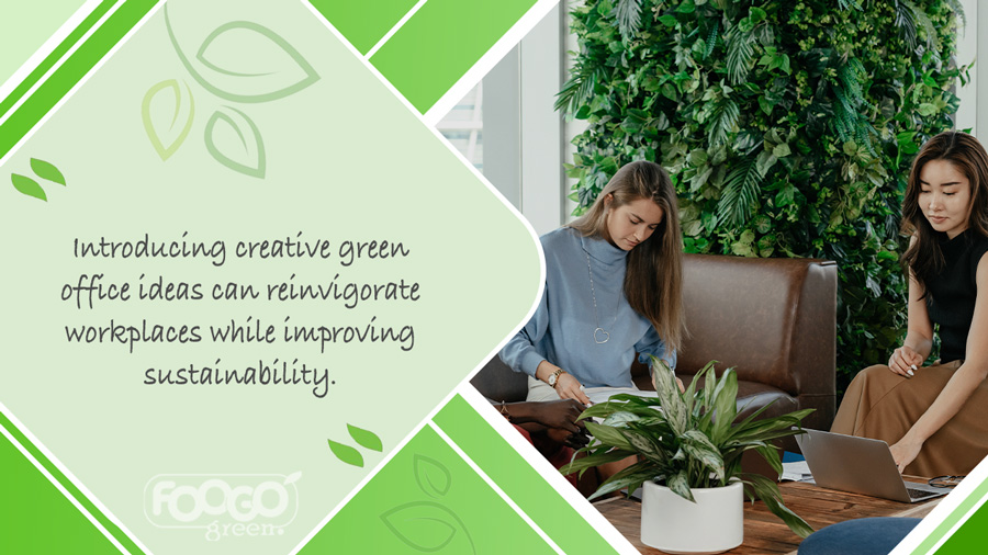 Two office workers collaborating in an office space containing plants and foliage