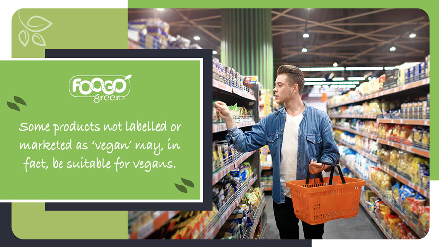 Shopper browsing supermarket aisles for vegan foods