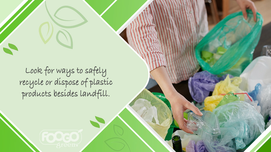 Person sorting plastic recycling at home